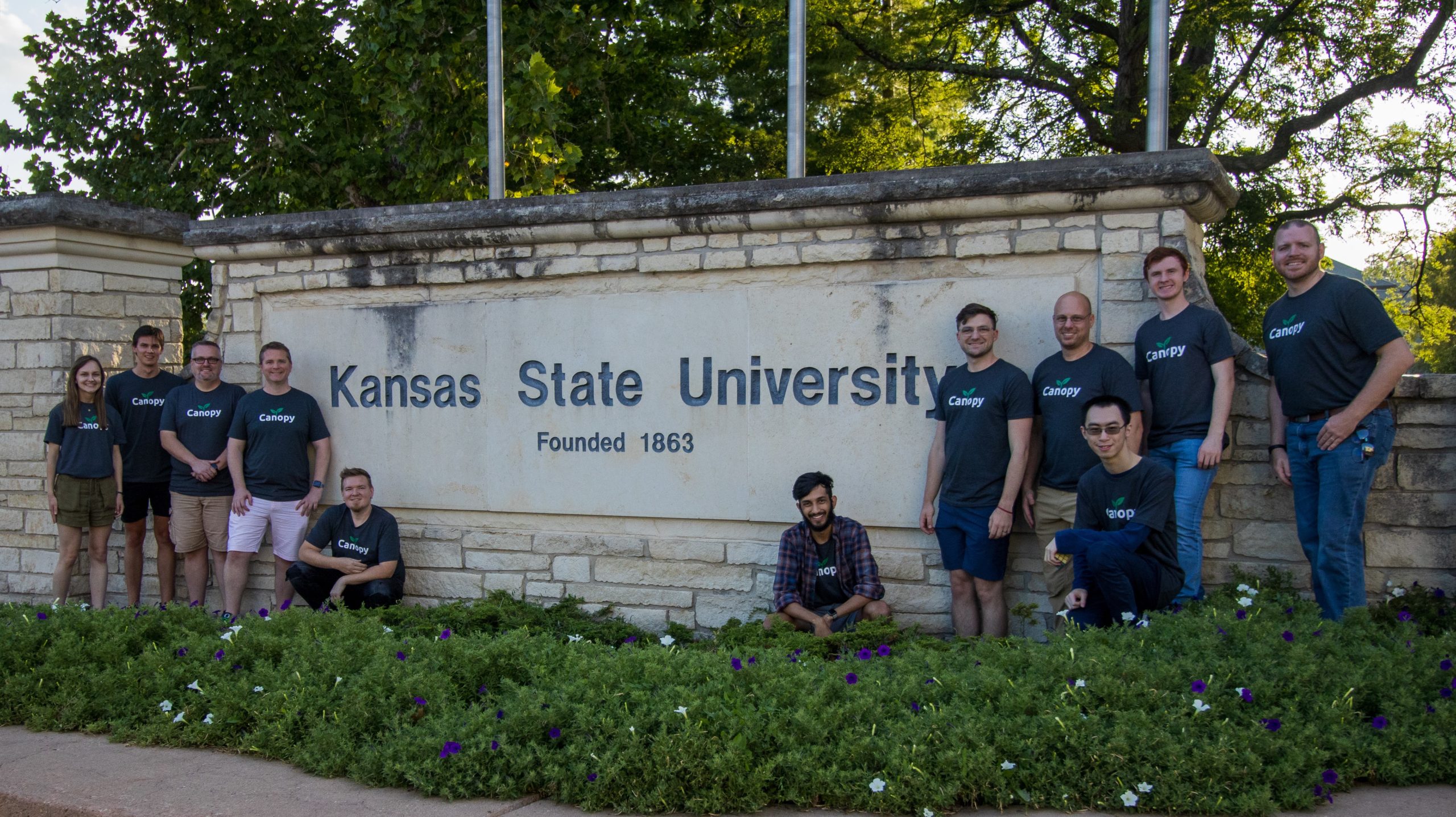 canopy_team_photo_1_cropped Canopy team in front of Kansas State University sign